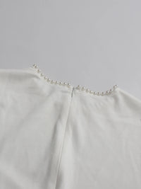 Abaya mit Perlenbesatz